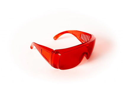 Red glasses against blue and green light.