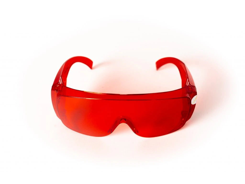 Red glasses against blue and green light.